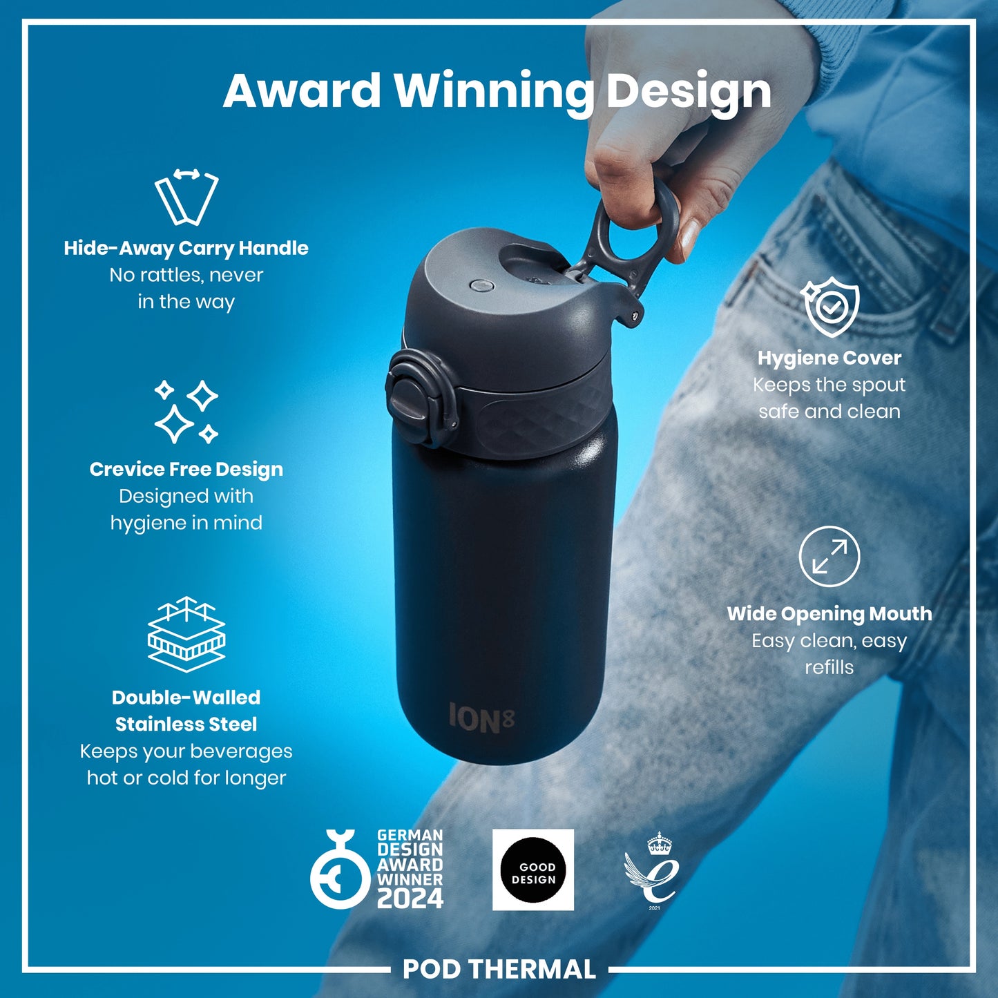 A person holds a dark-grey, double-walled stainless steel water bottle with a wide mouth and hidden carry handle. The bottle's design prioritizes hygiene and ease of use; it's an award-winning design.