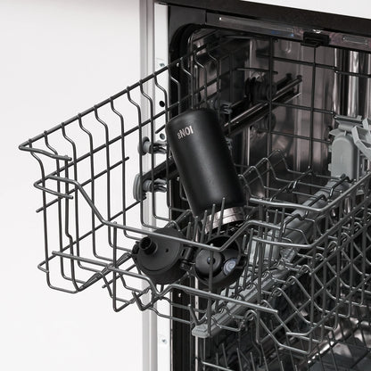 A black reusable bottle labeled "ION8" sits inside an open dishwasher's upper rack amidst a kitchen setting.