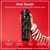 A black, stainless steel water bottle, with a flip top, is being held; it features a video game design. The bottle is shown against a red background. 