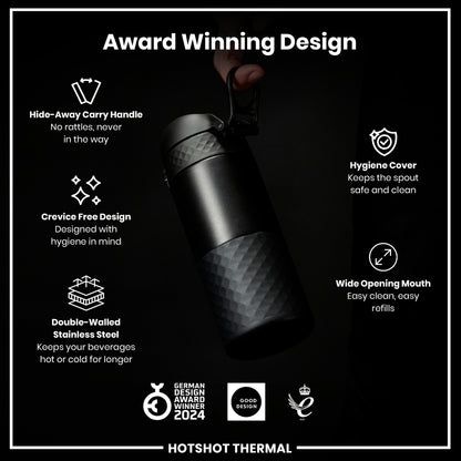 A black, double-walled stainless steel thermos is being held; its features are highlighted against a dark background, emphasizing its award-winning design and ease of use. GERMAN DESIGN AWARD WINNER 2024, GOOD DESIGN, and another 2021 award logo are displayed.