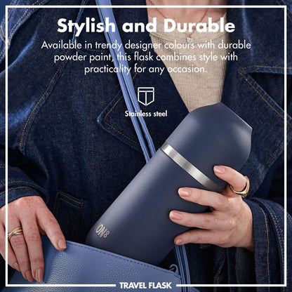 A person holds a blue travel flask with a silver band in a denim jacket pocket. Text reads: "Stylish and Durable Available in trendy designer colours with durable powder paint this flask combines style with practicality for any occasion Stainless steel TRAVEL FLASK."