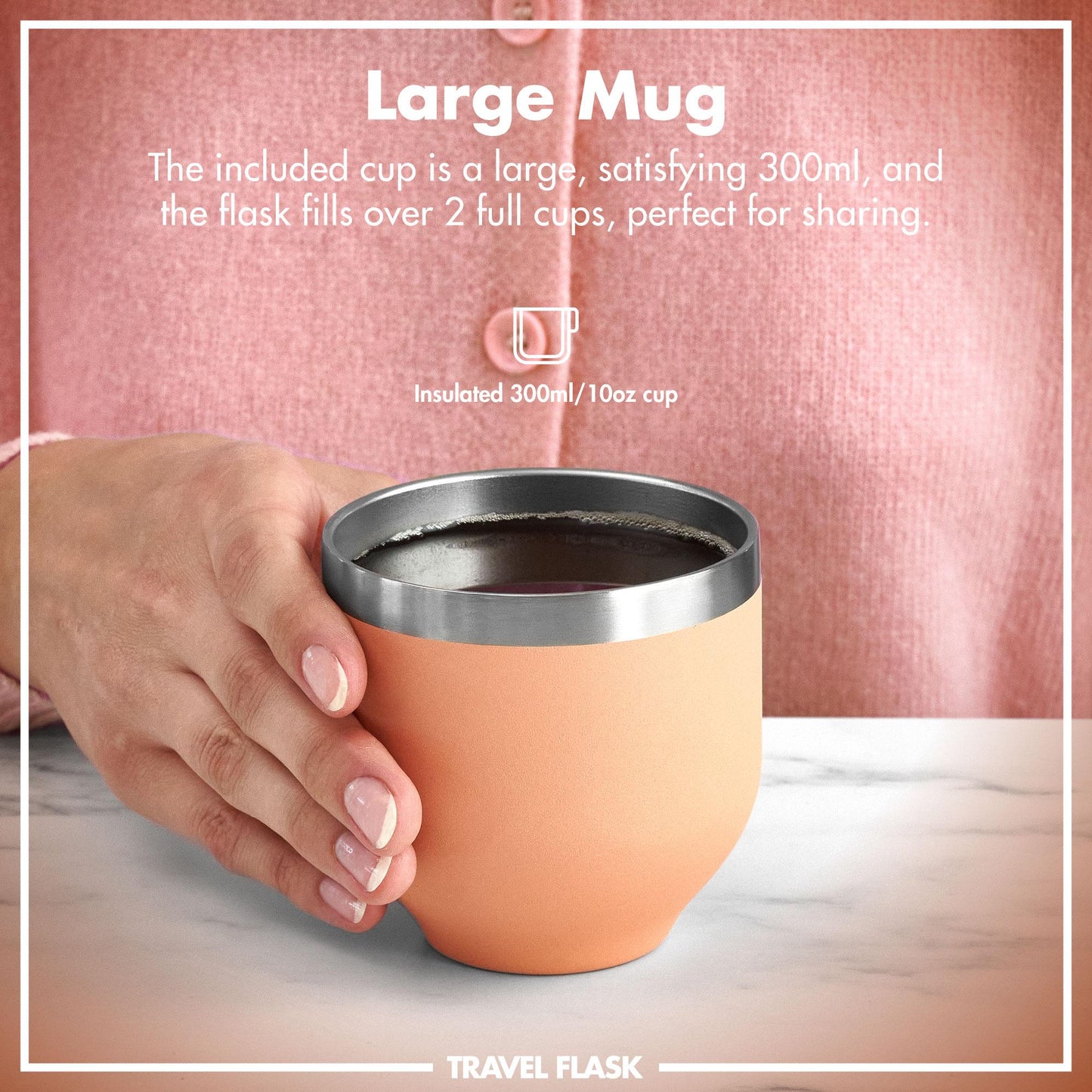 A hand holds an insulated 300ml/10oz cup with a metallic rim on a table against a pink garment background. Text: "Large Mug The included cup is a large, satisfying 300ml, and the flask fills over 2 full cups, perfect for sharing. Insulated 300ml/10oz cup TRAVEL FLASK"