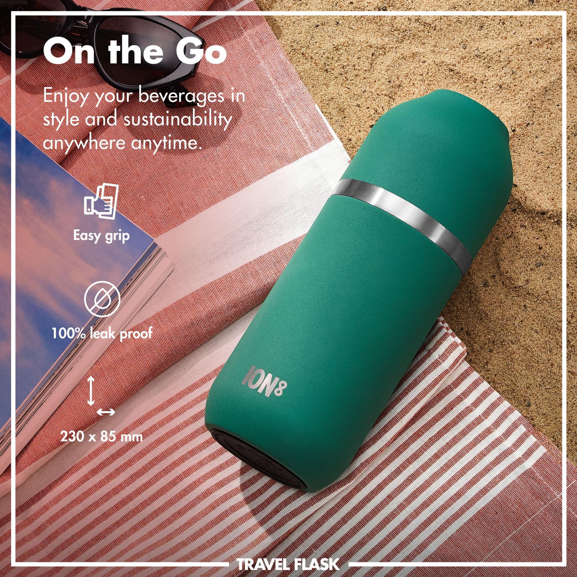 A green travel flask lies on a striped beach towel in the sand surrounded by sunglasses and a magazine. Text reads On the Go Enjoy your beverages in style and sustainability anywhere anytime Easy grip 100% leak proof 230 x 85 mm ION8 TRAVEL FLASK